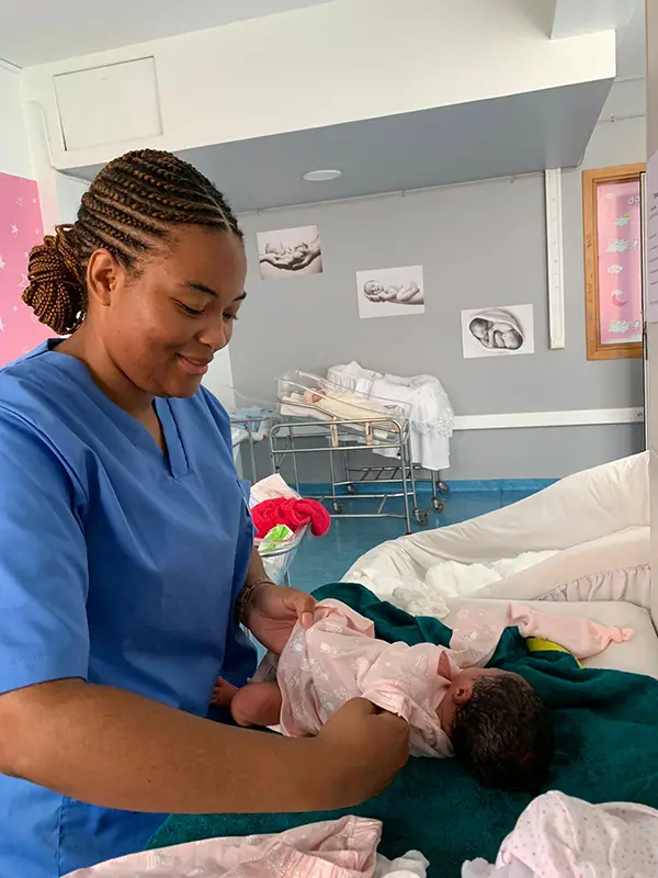 Veronique Wright holding an infant