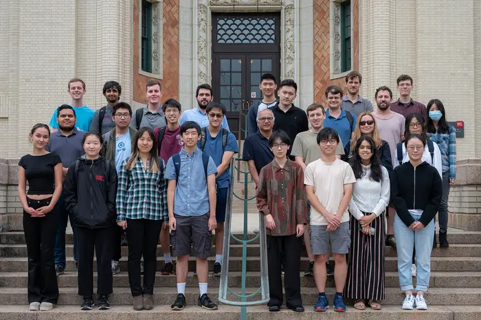 Groups of students standing together.