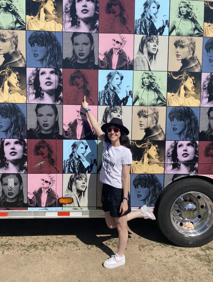 Regina Gamboa poses with Eras tour merchandise 