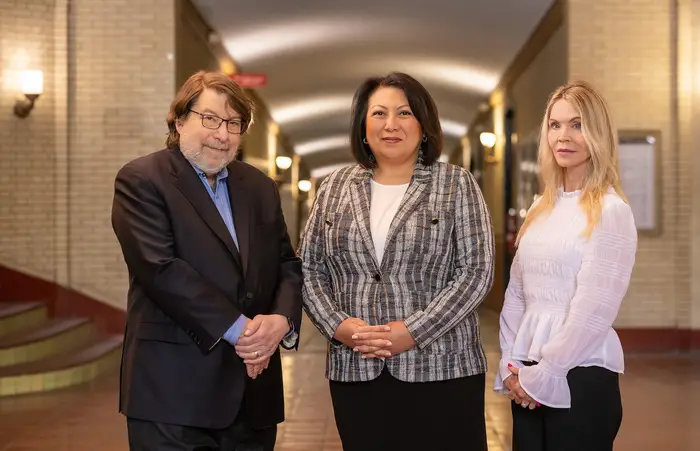 The Collaboratory Against Hate’s new co-directors, Mark Kamlet (left) and Lisa Nelson (right), pose with Susan Baida (center), executive director.