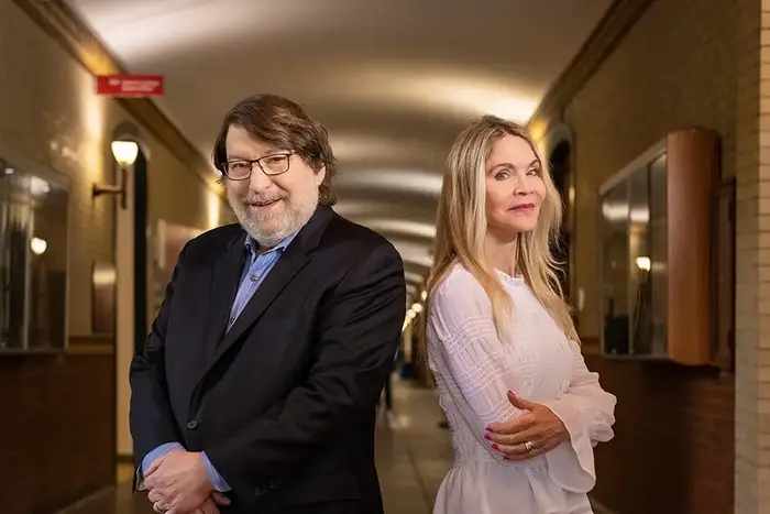 Mark Hamelt and Lisa Nelson standing in Baker Hall hallway