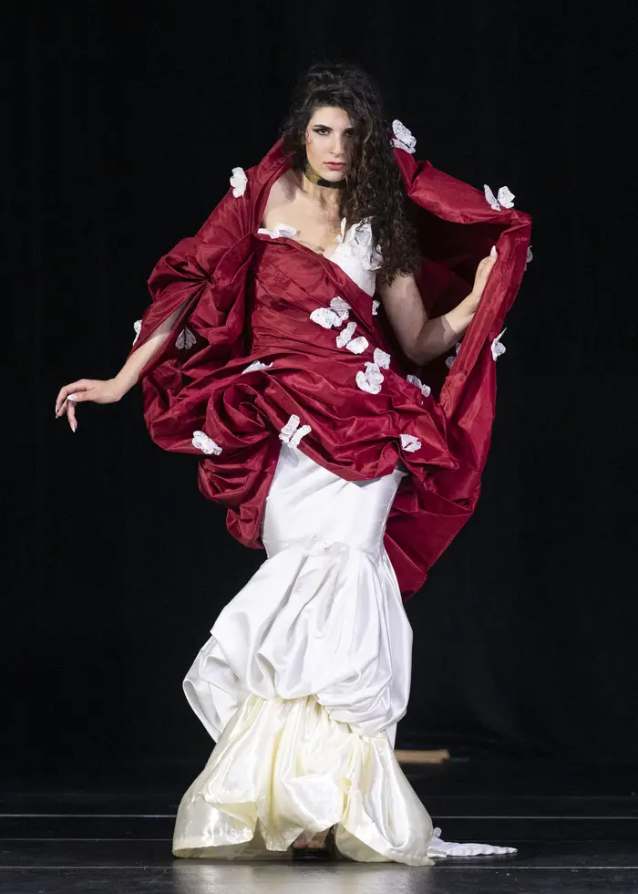 Lunar gala model wearing red and white dress with shoulder accents