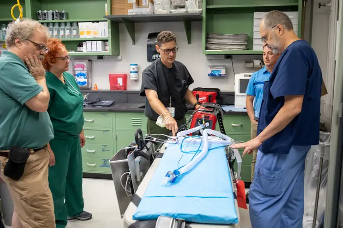 The team at Pitt prepares to test the device. 