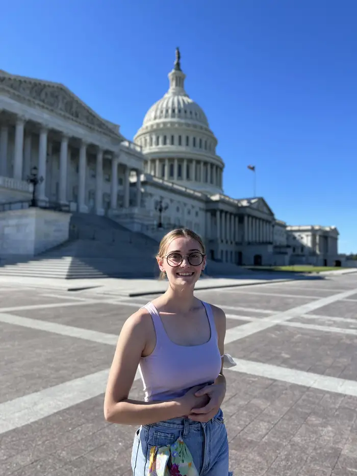 JoJo Huczko standing in front of Capitol Building