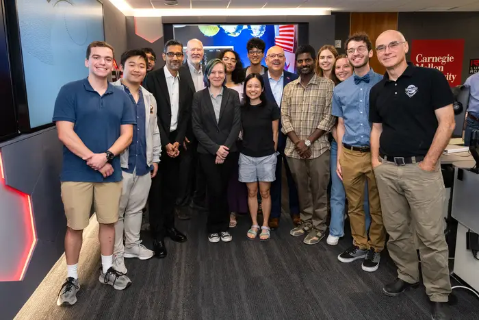 Sundar Pichai poses for a group photo in Carnegie Mellon Mission Control.