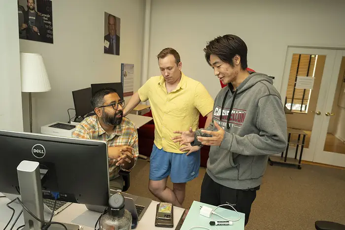 Ani Kapuria, Max Holmes and Bo Xie talking