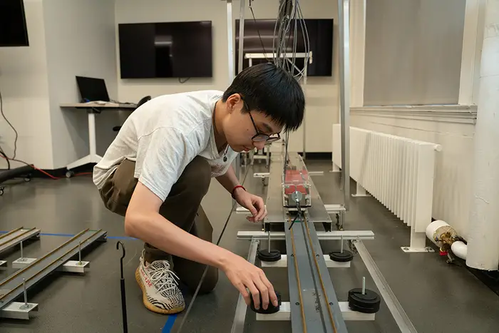 Student tests various bridge thicknesses, materials, and loads.