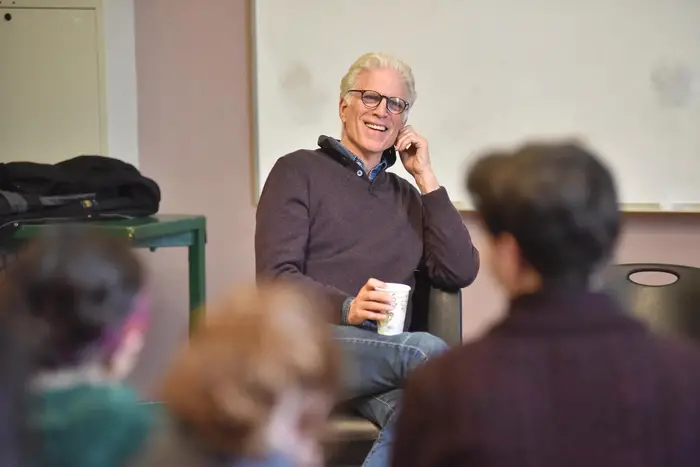 Ted Danson speaks to a class of students.