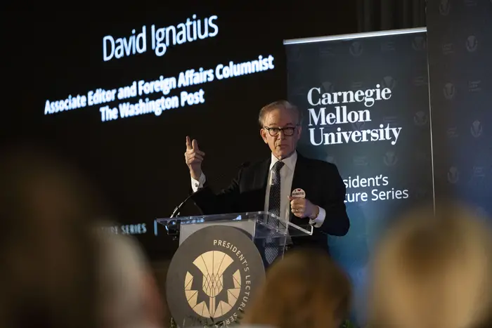 David Ignatius speaks on stage.