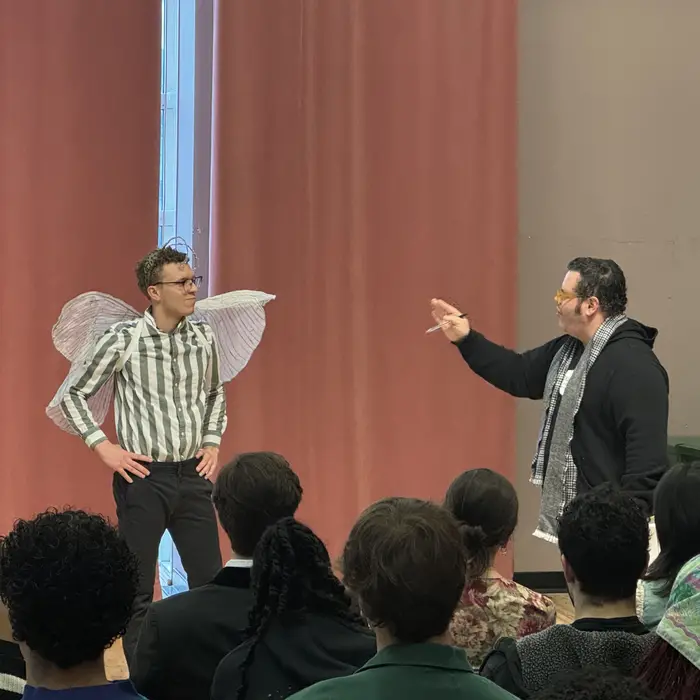 Josh Gad with an acting student who is wearing fairy wings