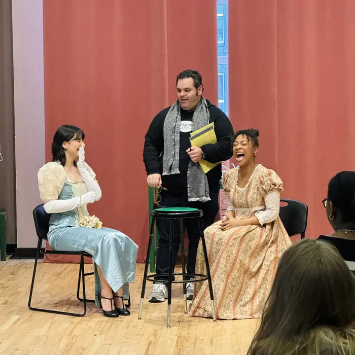 Josh Gad with two acting students who are laughing