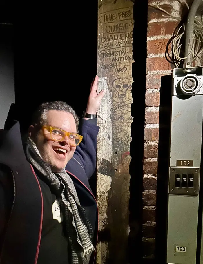 Josh Gad in front of a beam where he signed his name while attending Carnegie Mellon