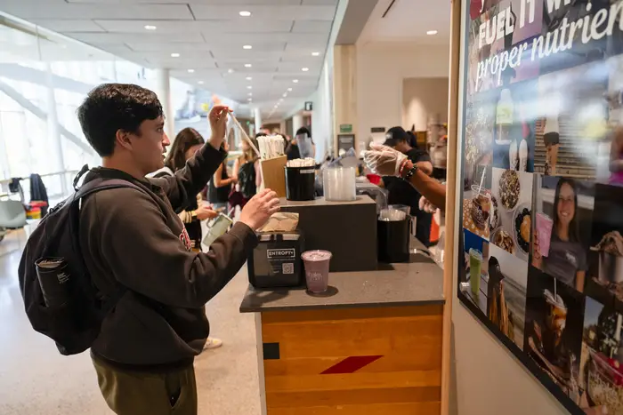 student getting a smoothie at Shake Smart