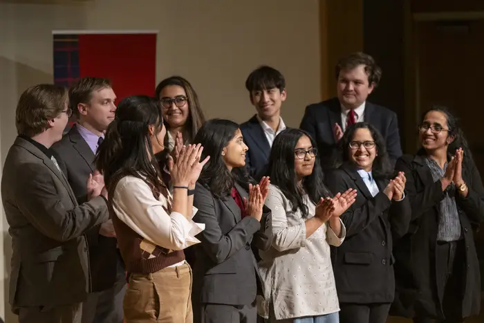 The 3MT championship participants gather onstage.