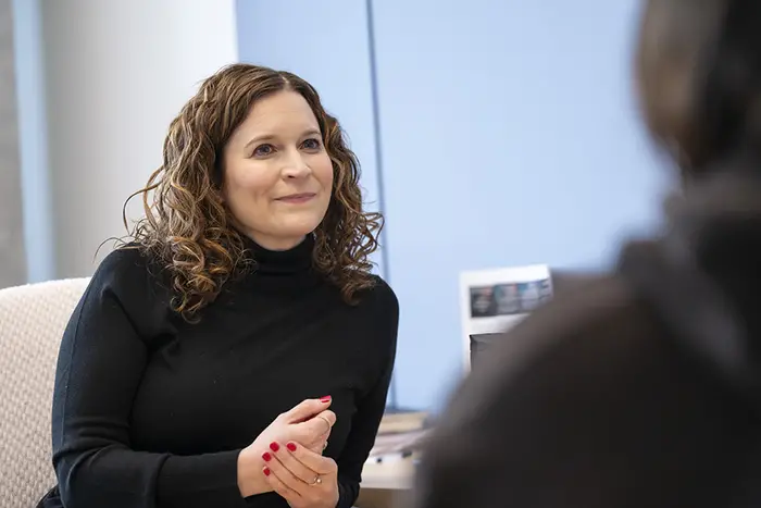 Jen Wegner speaks with a student