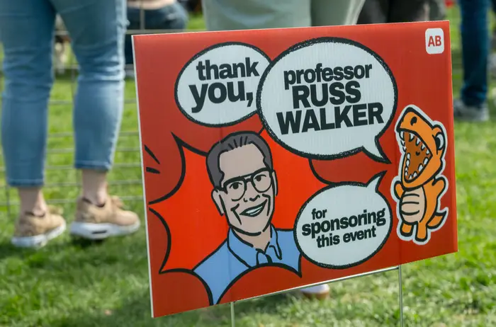 A sign from the event that reads "Thank you Russ Walker."