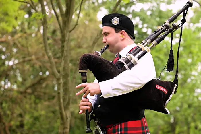 Logan McGregor plays the bagpipes.