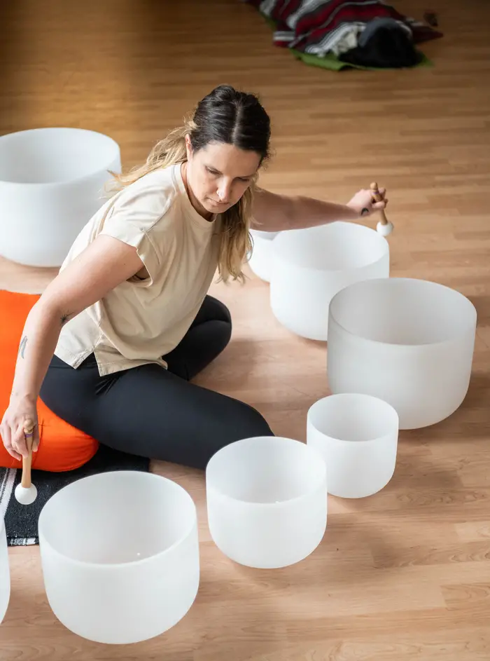 Laura Buermann plays the singing bowls.