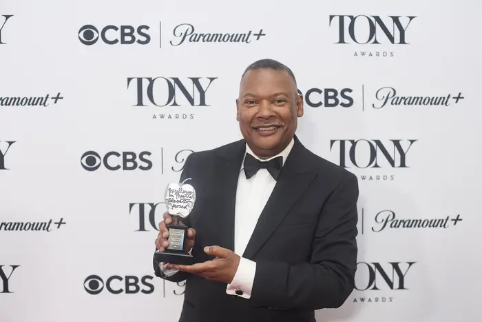 Gary Edwin Robinson with a Tony Award.