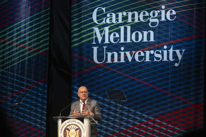 Farnam Jahanian at a podium speaking. 