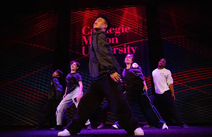 A student group dances.