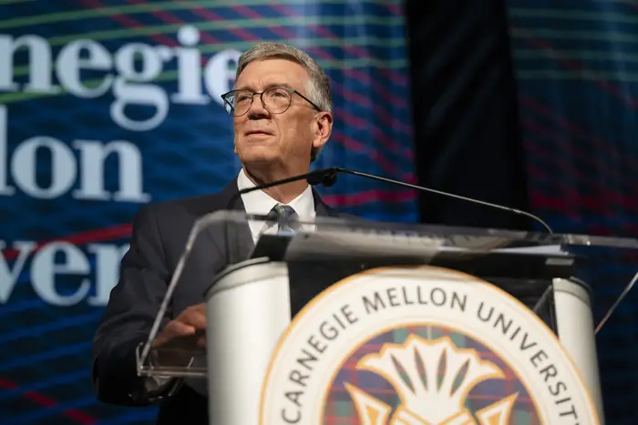 James H. Garrett Jr. speaks at a podium.