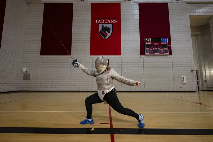 A woman in a fencing stance.
