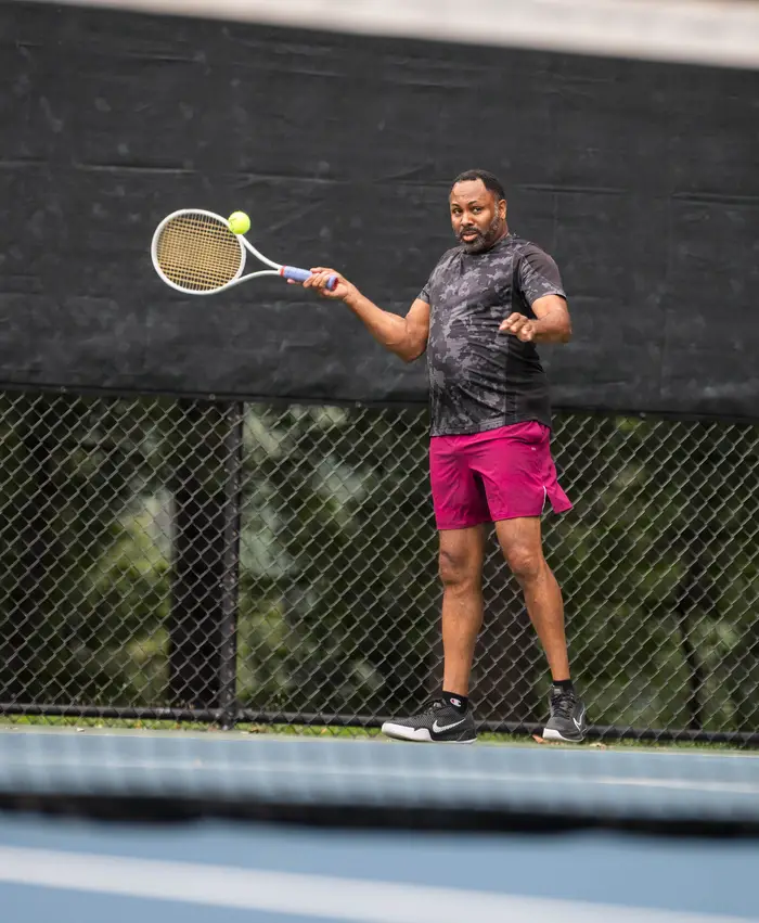 David Major plays tennis.