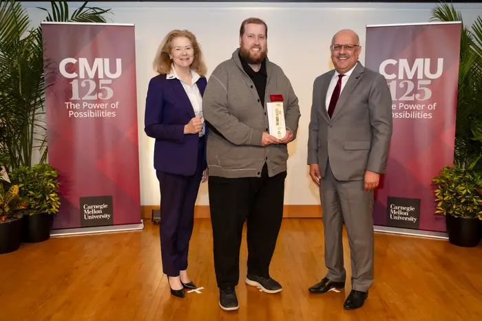 John Balash (center) receives his Andy Award