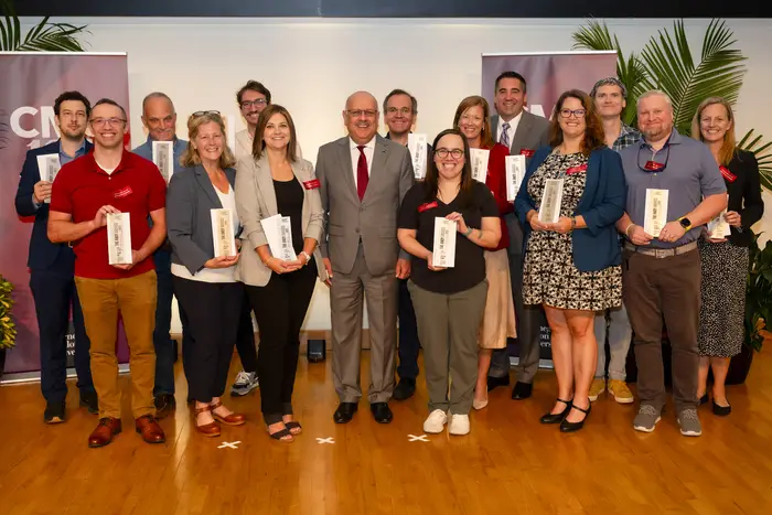 The Federal Transition Data Analytics team stands on stage with their Andy Awards