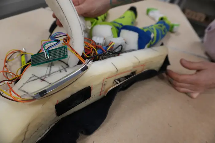 Layers of foam and custom ‘shapewear’ keep the electronics in place inside the neuron.