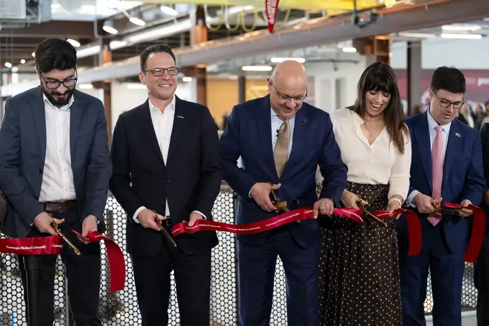 people cutting ribbon
