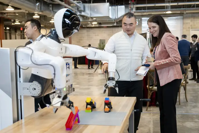 two people interacting with robot