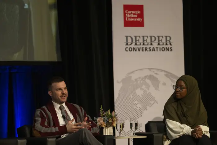 Stephen Sudia engages in a conversation onstage. 