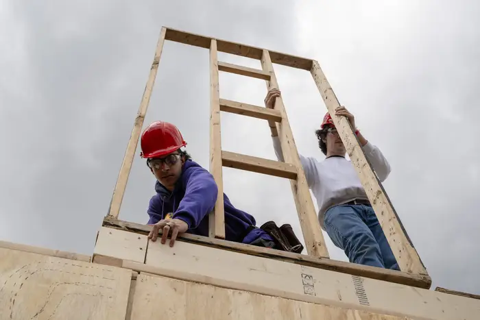 Students construct wooden Booths at Carnegie Mellon. 
