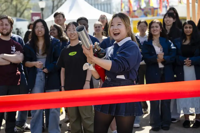 A student fires a t-shirt cannon. 
