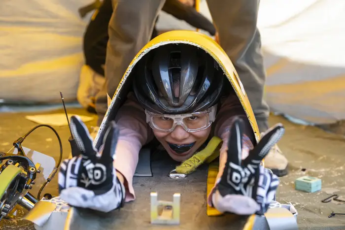 A student climbs into a Buggy. 