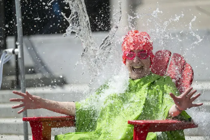 A dean is doused in water. 