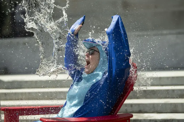 A dean gets doused in water. 