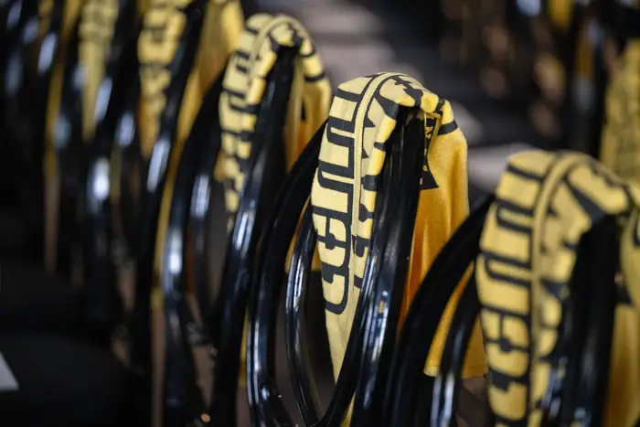 Terrible Towels line a row of chairs. 