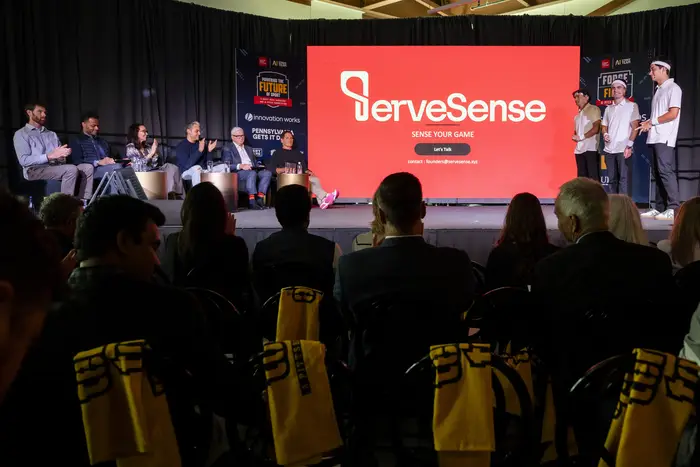 The ServeSense team pitches onstage. 