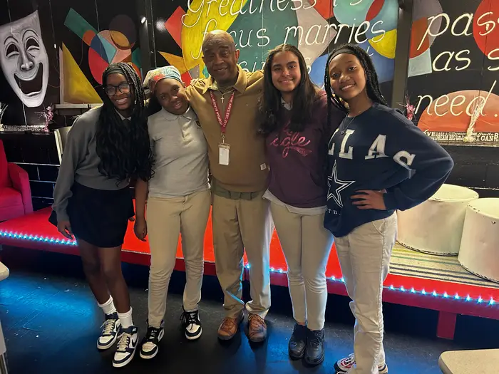 Freddie Hendricks poses for a photo alongside , from left, Indigo Goldsborough, Ja’Lani Rivers, Danasia Moore and Dakota Woodfin, all seventh-grade students. 