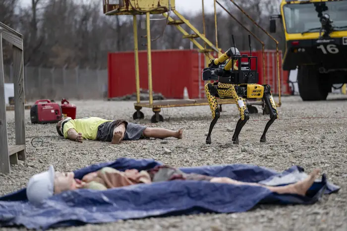 Robots assess dummies in a recent DARPA Triage Challenge.