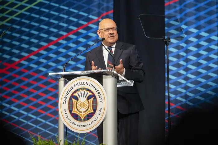 Farnam Jahanian speaks at a podium.