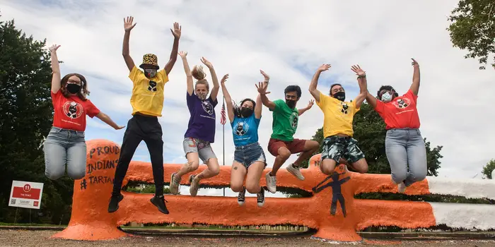 andrew-thompson-orientation-counselors-jumping-2000x1000-min.jpeg