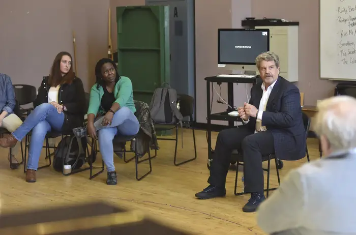 John Wells talks to a a class