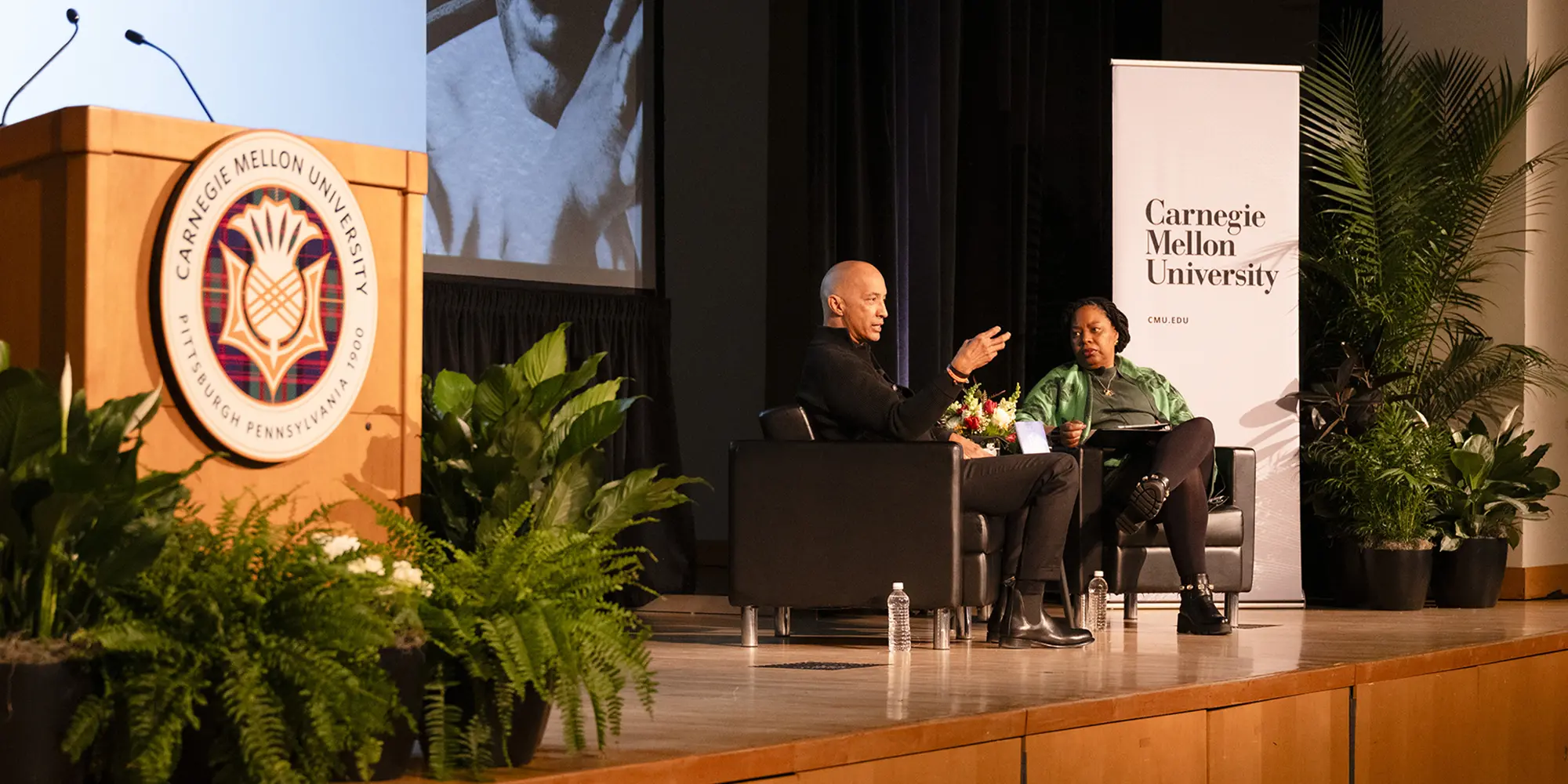 Byron Pitts and Wanda Heading-Grant seated on stage