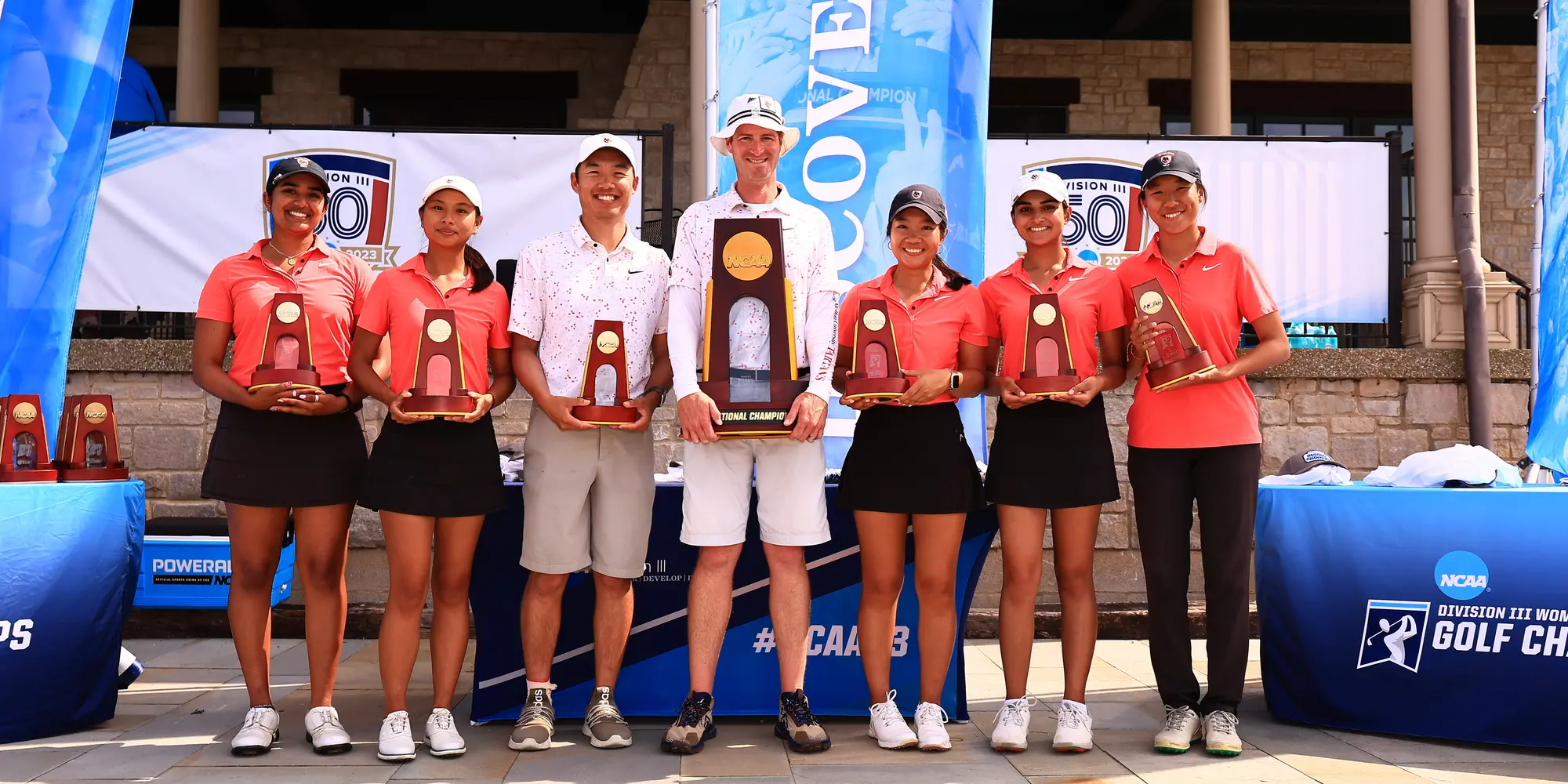 The CMU women's golf team with their championship trophy.