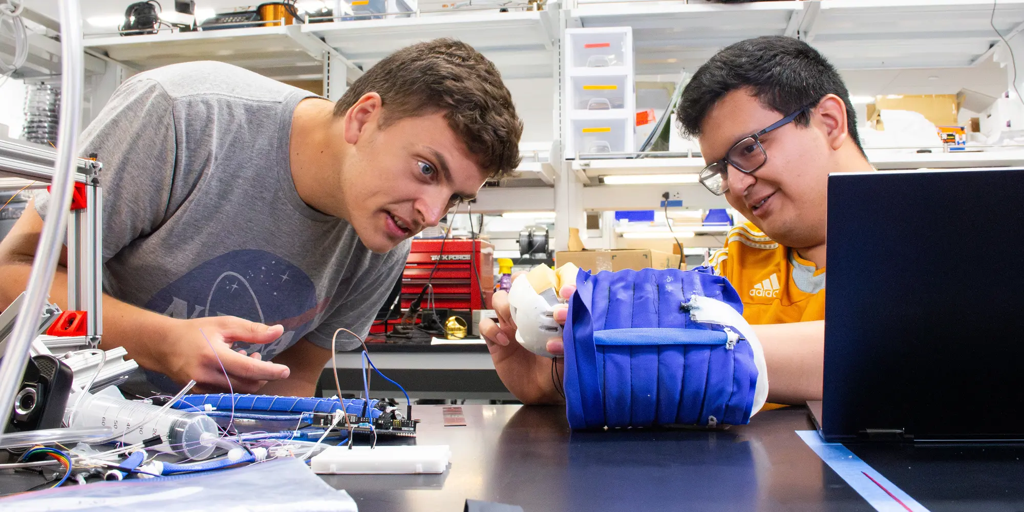 Researchers working in Vickie Webster-Wood's Lab.