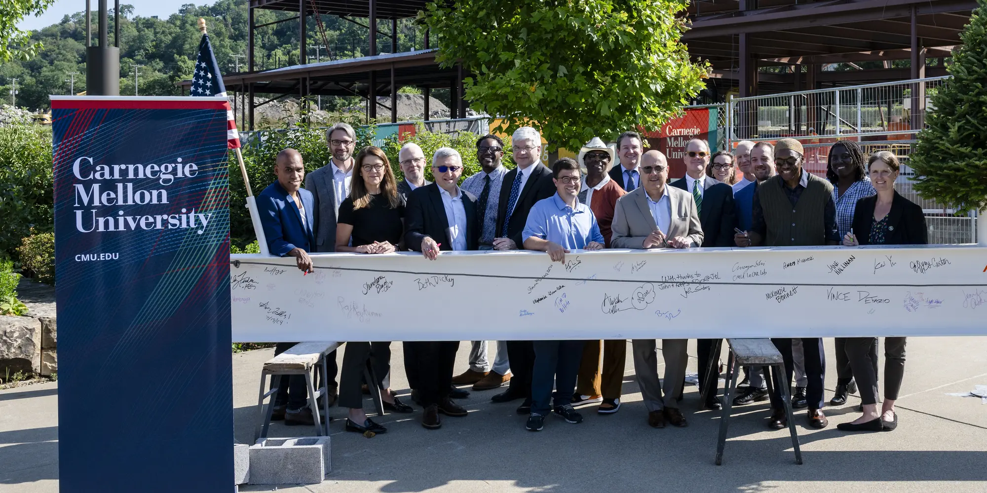 A group photo at the RIC beam signing